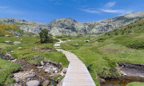 Crystal clear water river within peak of Penalara, Sierra de Guadarrama National Park, Madrid, Spain.